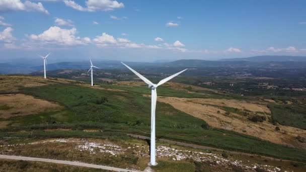 eolic generators spining with the wind in the mountains on a sunny day. High quality 4k footage - Metraje, vídeo