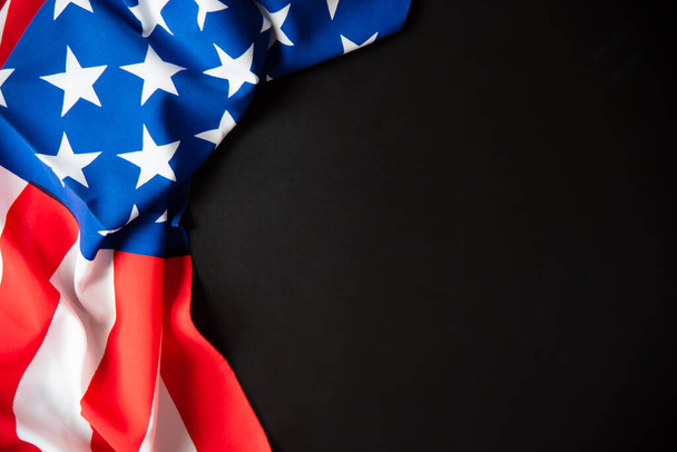 Colorful American flag close up in dark background with copy space for text insert. - Фото, зображення