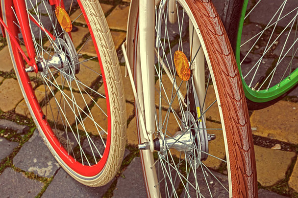 Vintage look at multicolored bicycle wheels - Foto, Imagem