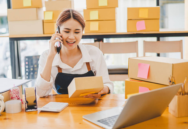 Small business owners online are chatting, selling products and checking orders for products that customers order. of online retailers - online shopping - 写真・画像