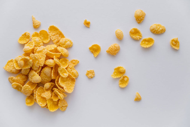 top view of dry and crispy corn flakes isolated on white  - Valokuva, kuva
