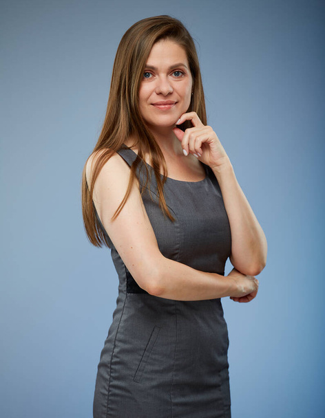 Thinking woman in office dress isolated portrait on blue. - Photo, Image