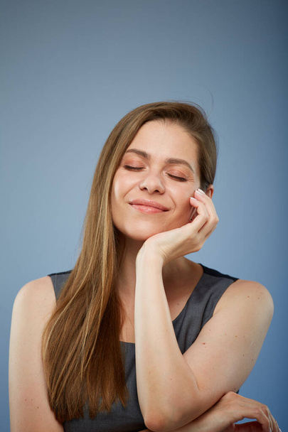 Happy smiling woman dreaming with eyes closed. isolated portrait. - Фото, зображення