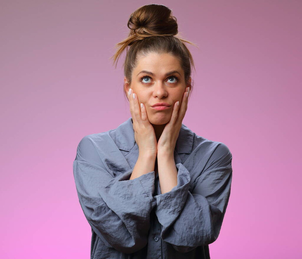 Boring woman wearing pajama, isolated on pink background, female face portrait - Foto, imagen
