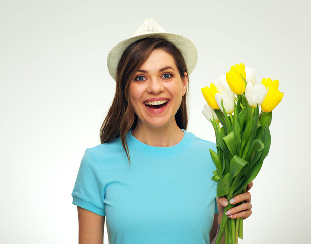 Laughing woman with happiness emotion holding flowers. isolated female portrait. - Photo, Image