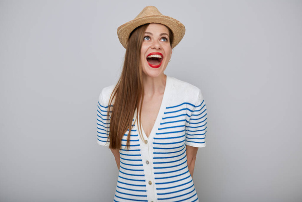 Smiling amazed woman isolated portrait. Surprising girl in white dress and straw summer hat posing emotional and looking up. - Φωτογραφία, εικόνα