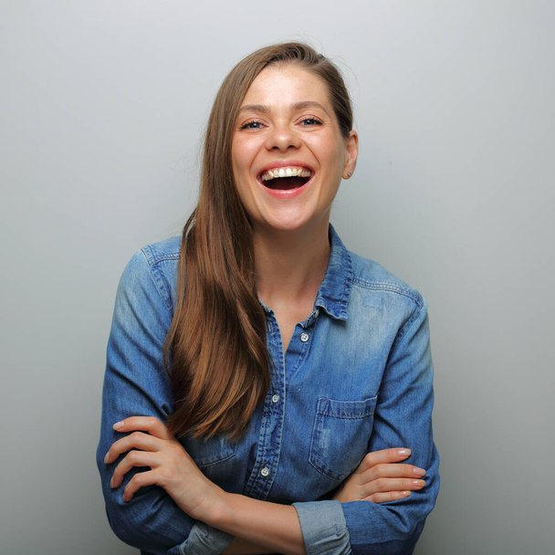 Emotional laughing woman isolated portrait on gray wall background. Wide smile with teeth. Mouth open. - Φωτογραφία, εικόνα