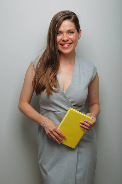 Teacher woman or student, business woman with yellow book isolated female portrait.   - Foto, Imagem