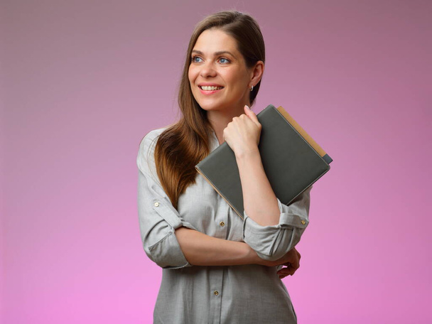 Happy teacher or student woman holding book and looking away, isolated portrait.  - Fotoğraf, Görsel