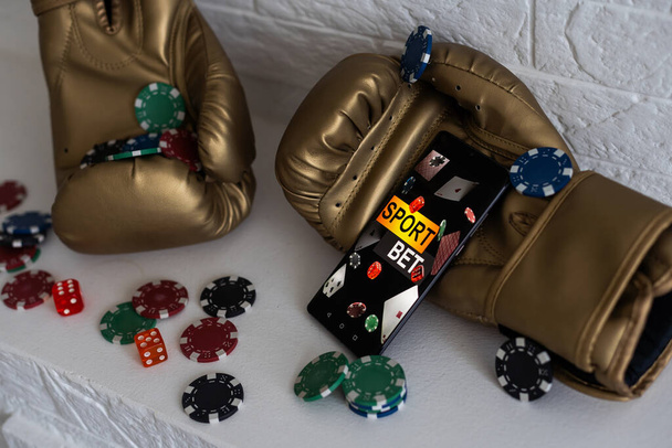 boxing gloves and smartphone with bets - Φωτογραφία, εικόνα