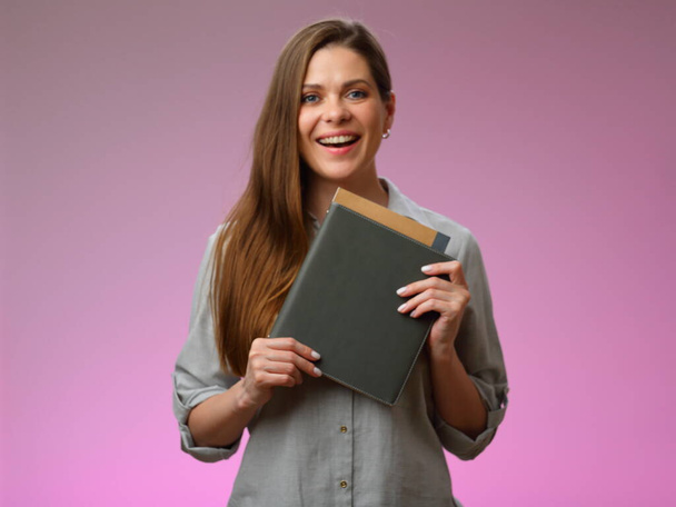 Happy teacher or student woman holding book, isolated portrait. Emotional woman with open mouth. - Foto, afbeelding