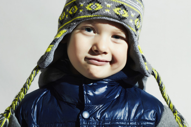 Funny child.fashion kids.smiling fashionable little boy in winter color cap - Fotó, kép