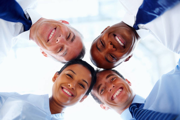 Teamwork leads to success. Low angle portrait of team of executives - Foto, Imagem