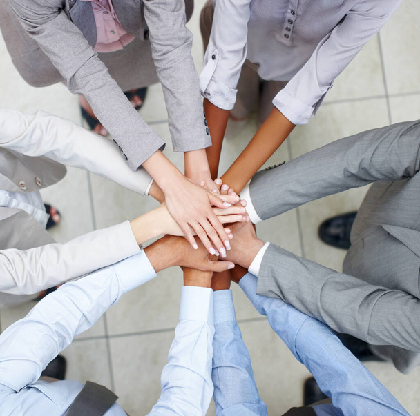 Team merging. Merged colleagues put their hands together to celebrate their unity - Fotoğraf, Görsel