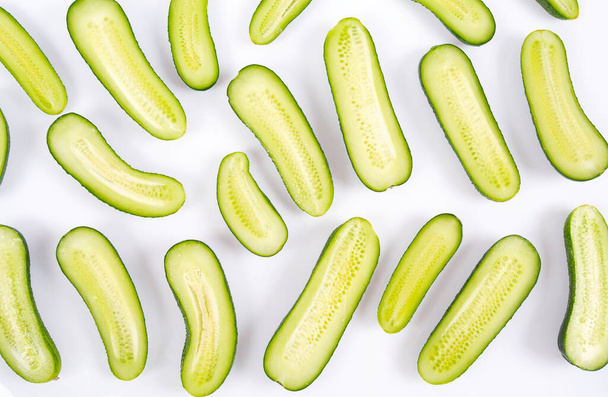 cut cucumbers isolated on white background - 写真・画像