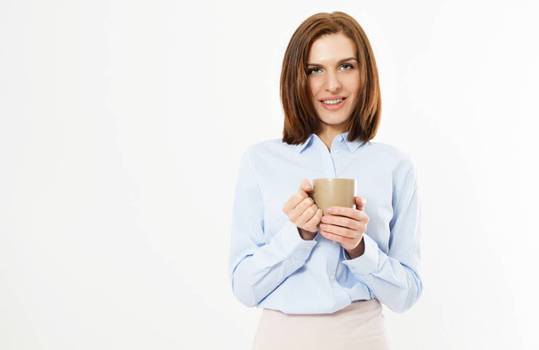 Beautiful young business girl holding a mug with a hot drink - beautiful modern woman brunette - Фото, изображение