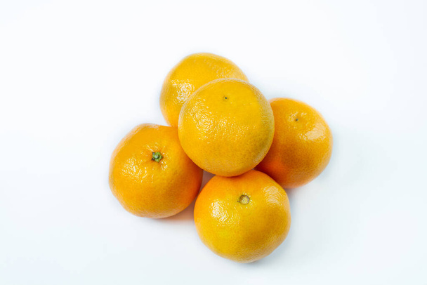 Copy space and mock up. Mandarin, tangerine citrus fruit isolated on white background. - Zdjęcie, obraz