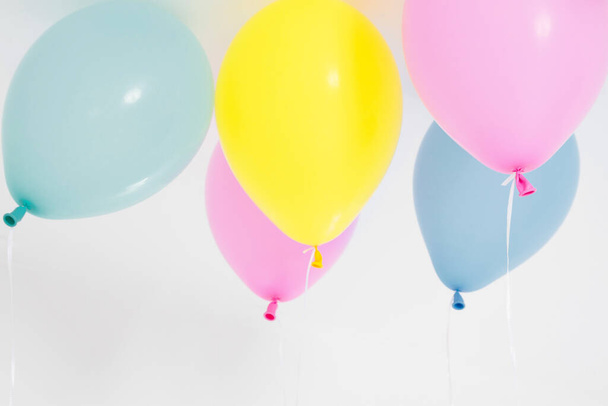 Colorful party balloons background. Isolated on white. Copy space - Фото, изображение