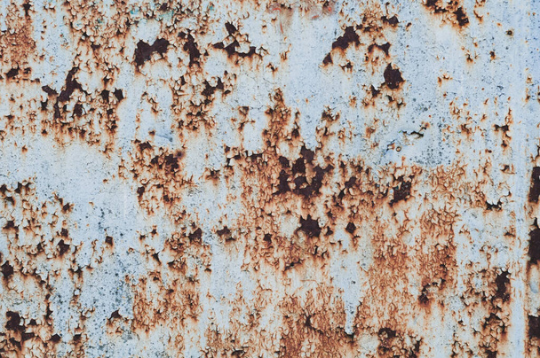 old rusty sheet of metal with peeling faded paint, covered with dust and dirt, grungy texture surface, close-up vintage background. - Photo, Image