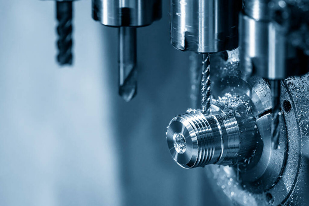 The multi-tasking CNC lathe machine swiss type tapping the brass shaft parts. The high technology metal working with CNC turning machine. - Valokuva, kuva