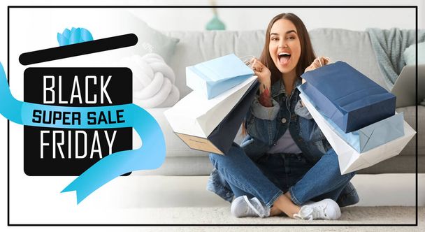 Happy woman with shopping bags at home. Black Friday sale - Фото, зображення