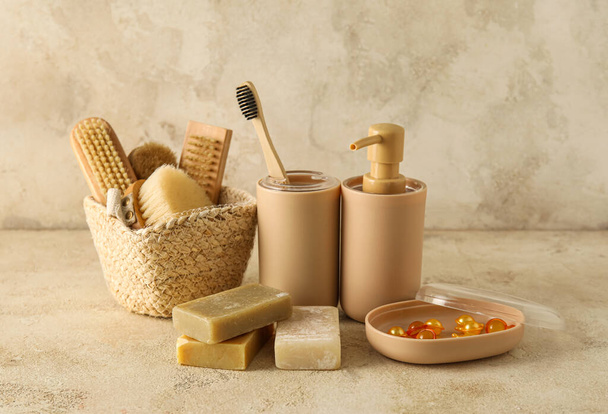 Set of bath supplies with hair capsules on light background - Valokuva, kuva