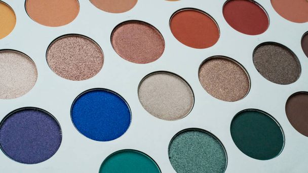 Selective focus of eyeshadow palette with various colors in pearly and matte closeup. - Fotografie, Obrázek
