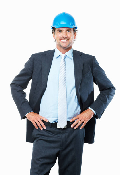 Architect smiling. Portrait of smart architect standing with hands on waist against white background - Photo, Image
