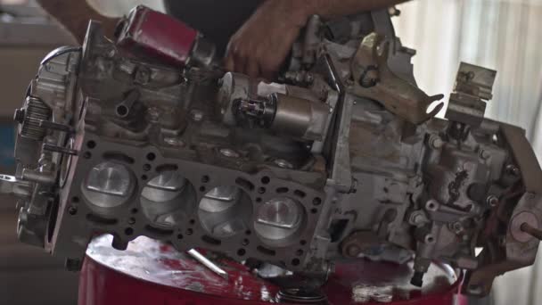 Repairman Fixing Broken and Disassembled Car Engine on Bench. - Footage, Video