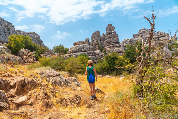 A young woman trekking in the Torcal de Antequera on the green and yellow trail, Malaga. Andalusia - Photo, Image