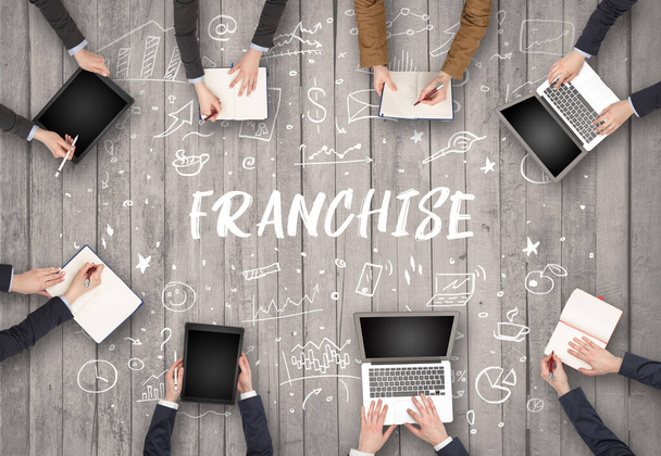 Group of business people working in office with FRANCHISE inscription, coworking concept - Foto, Imagem