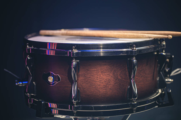 Snare drum on a black background, musical instrument, musical concept. - Zdjęcie, obraz