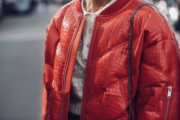Milan, Italy - February, 24: Street style, woman wearing red shiny leather crocodile print puffer jacket. - Foto, immagini
