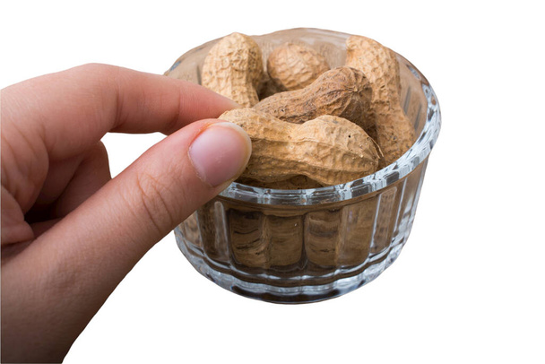 Peanuts in a plate  on a white background. Peanut isolate. - Foto, immagini