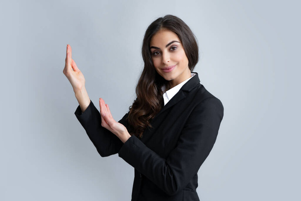 Woman point at copy space, showing copyspace pointing. Promo, girl showing advertisement content gesture, pointing with hand recommend product. Female business model face - Фото, изображение