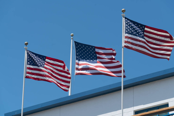 usa flags on blue sky background - Foto, Imagem