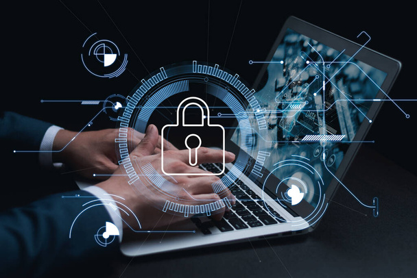 Cybersecurity and privacy concepts to protect data. Lock icon and internet network security technology. Businessmen protecting personal data on laptop and virtual interfaces. - 写真・画像