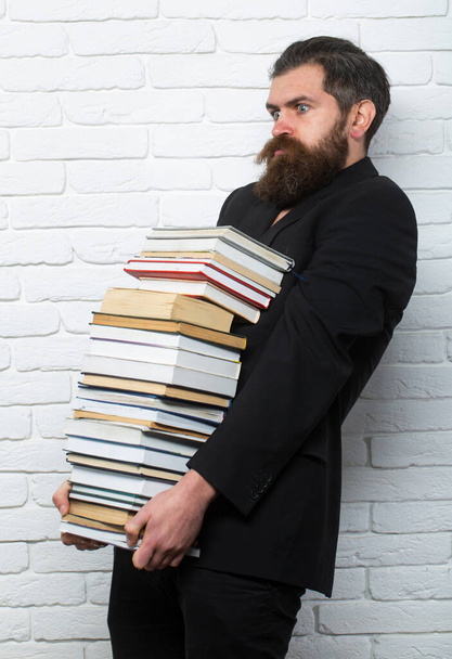 Funny teacher or professor with book stack. Thinking serious mature teacher. Falling books concept. Mature professor near educational books for exams at the university. Teachers day - Foto, immagini