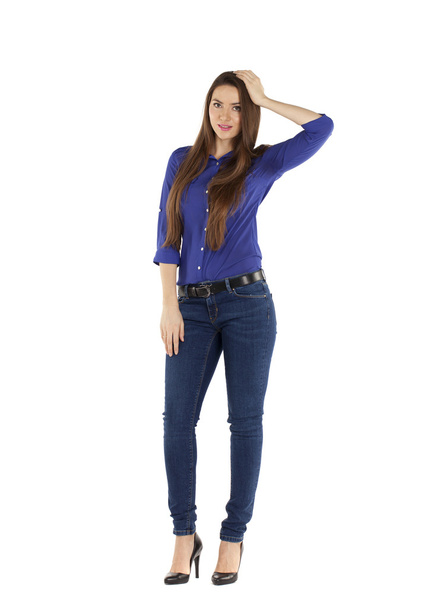 Portrait of a beautiful woman in blue jeans and blue shirt - Zdjęcie, obraz