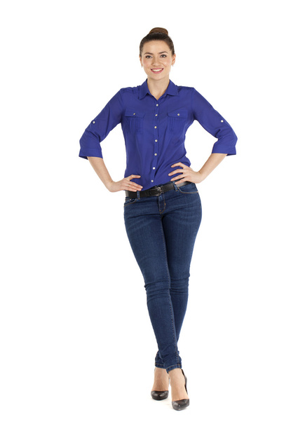 Portrait of a beautiful woman in blue jeans and blue shirt - Фото, зображення