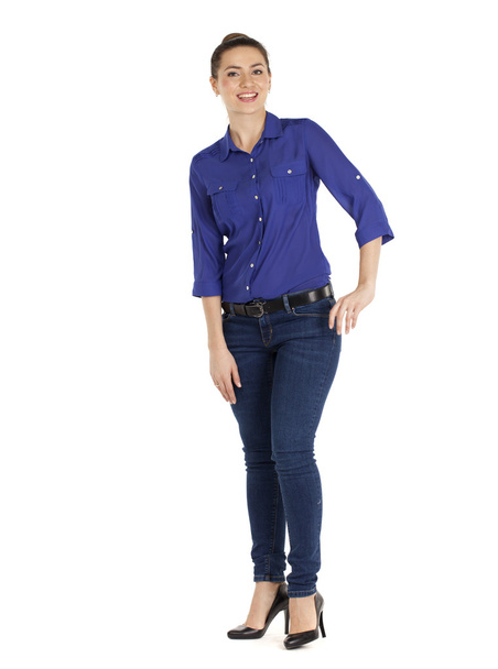 Portrait of a beautiful woman in blue jeans and blue shirt - Fotó, kép