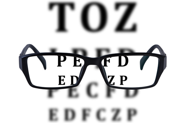 Eye glasses isolated with eye chart background. - 写真・画像
