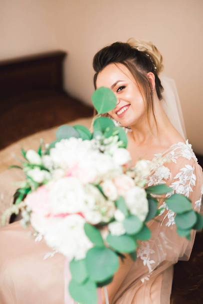 Bride holding big and beautiful wedding bouquet with flowers. - 写真・画像