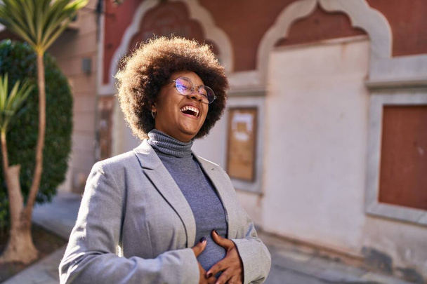 African american woman executive smiling confident standing at street - Photo, Image