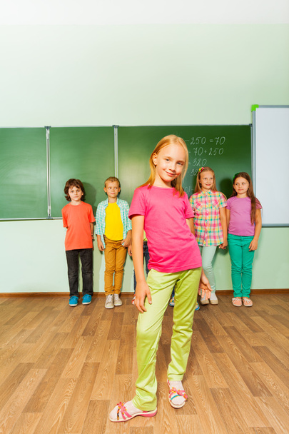 Girl stands in front of kids - Photo, Image