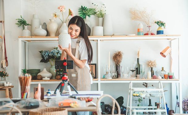 Small business owners are live streaming. Sell products to customers who come to see to buy and take orders. Check out the orders that customers order from online retailers - online shopping. - Photo, Image