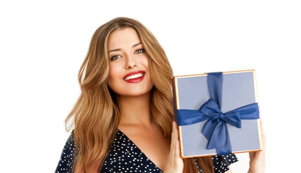 Birthday, Christmas or holiday present, happy woman holding a blue gift or luxury beauty box subscription delivery isolated on white background, portrait - Photo, Image