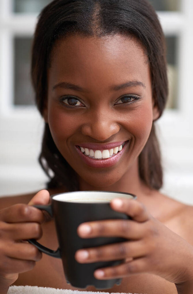 My day starts after coffee. a beautiful young woman enjoying a hot beverage - Photo, Image