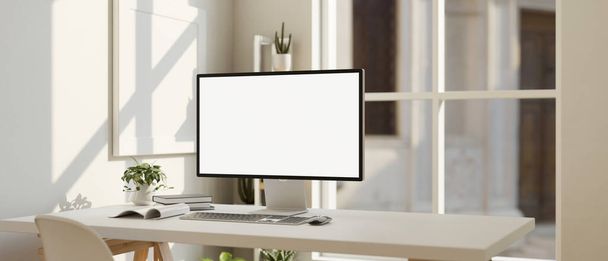 Дизайн интерьера белого офиса с компьютерным макетом белого экрана и декором на белом столе напротив окна. 3D рендеринг, 3D иллюстрация - Фото, изображение