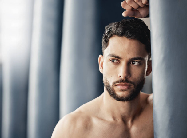 Skincare, cosmetics and grooming with handsome man looking confident after beauty treatment. Young male posing and thinking, enjoying self care and routine hygiene, proud and relax alone at home. - Fotoğraf, Görsel